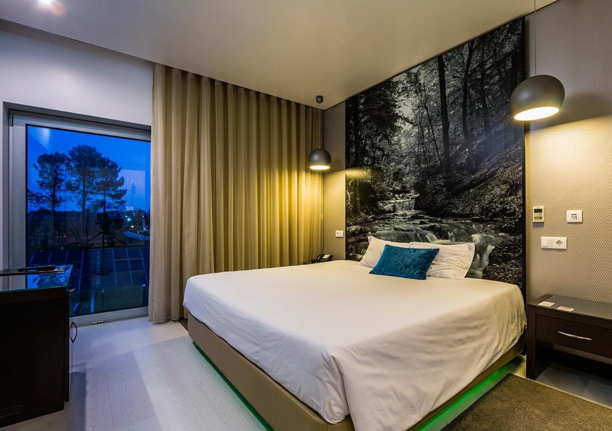 Uma cama ou camas num quarto em Lisotel - Hotel & Spa
