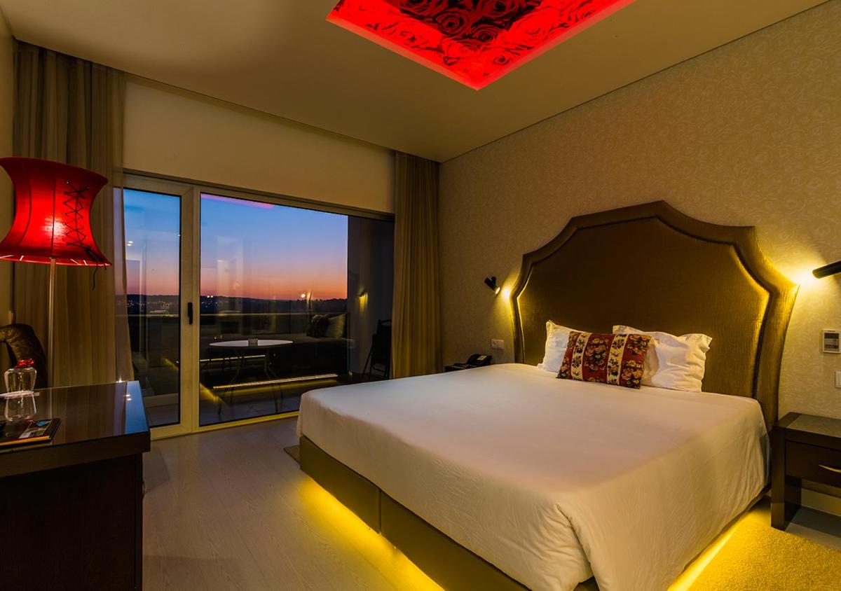 Uma cama ou camas num quarto em Lisotel - Hotel & Spa