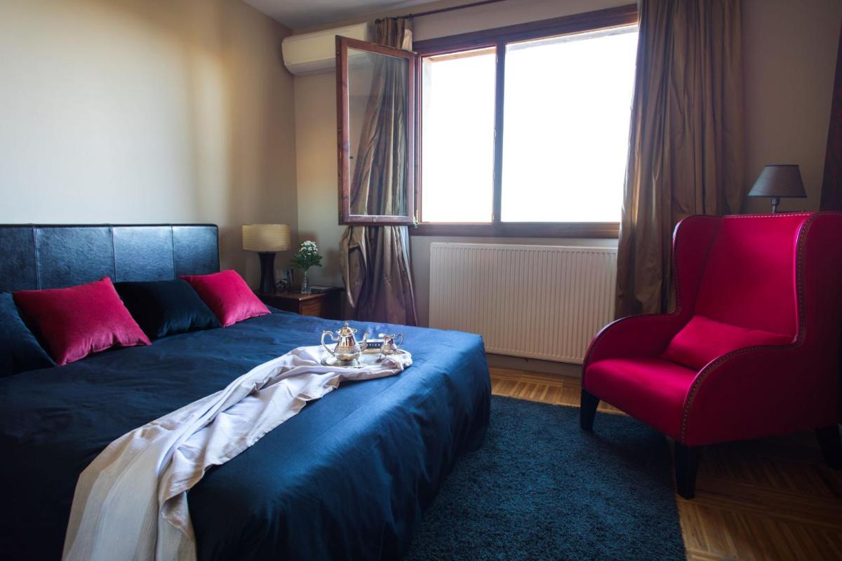 Cama o camas de una habitación en Hotel Cardamomo Sigüenza