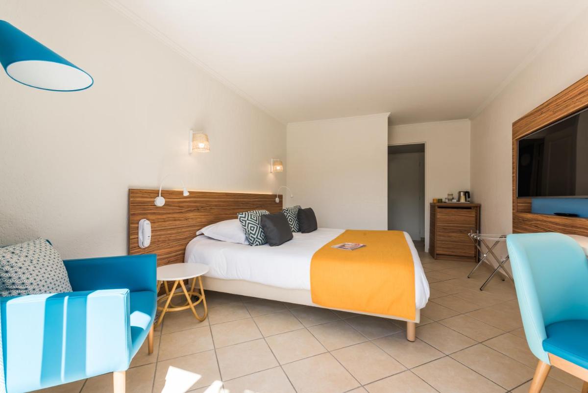 Un ou plusieurs lits dans un hébergement de l'établissement Hôtel de l'Esterel Pierre & Vacances