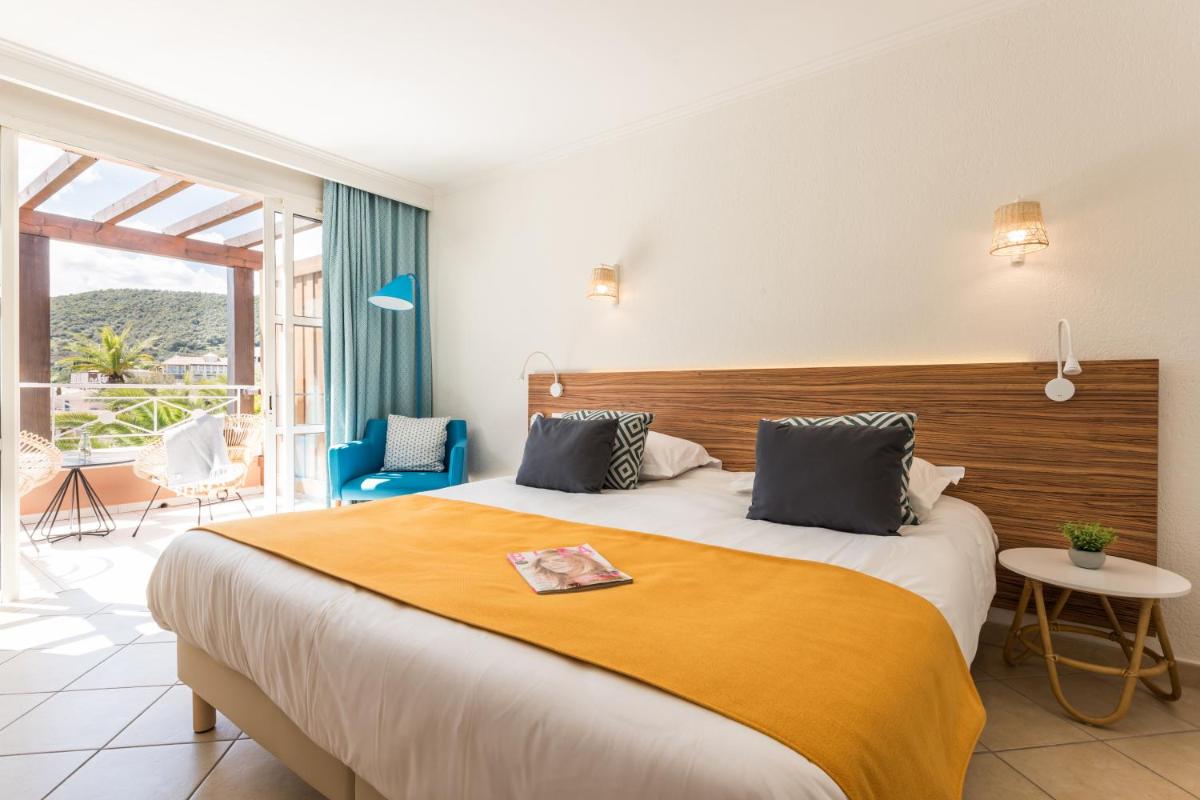 Un ou plusieurs lits dans un hébergement de l'établissement Hôtel de l'Esterel Pierre & Vacances