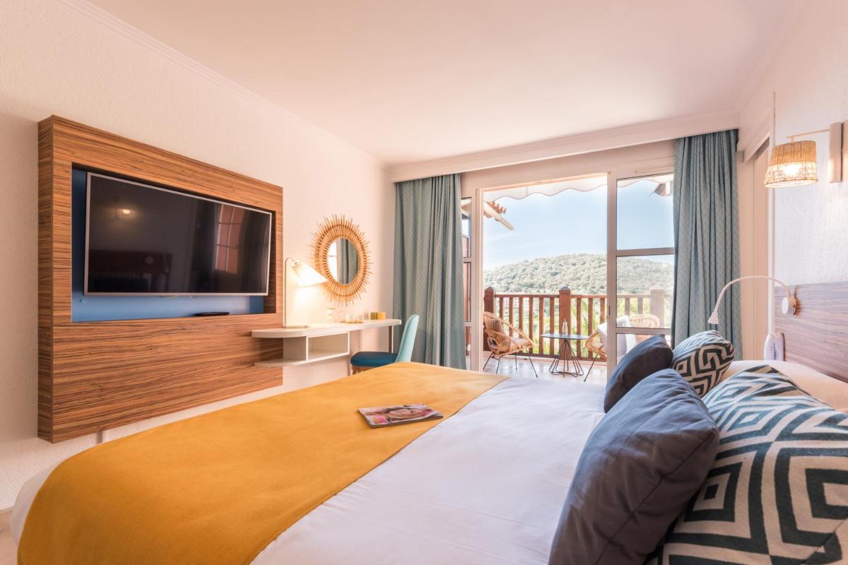 Un ou plusieurs lits dans un hébergement de l'établissement Hôtel de l'Esterel Pierre & Vacances