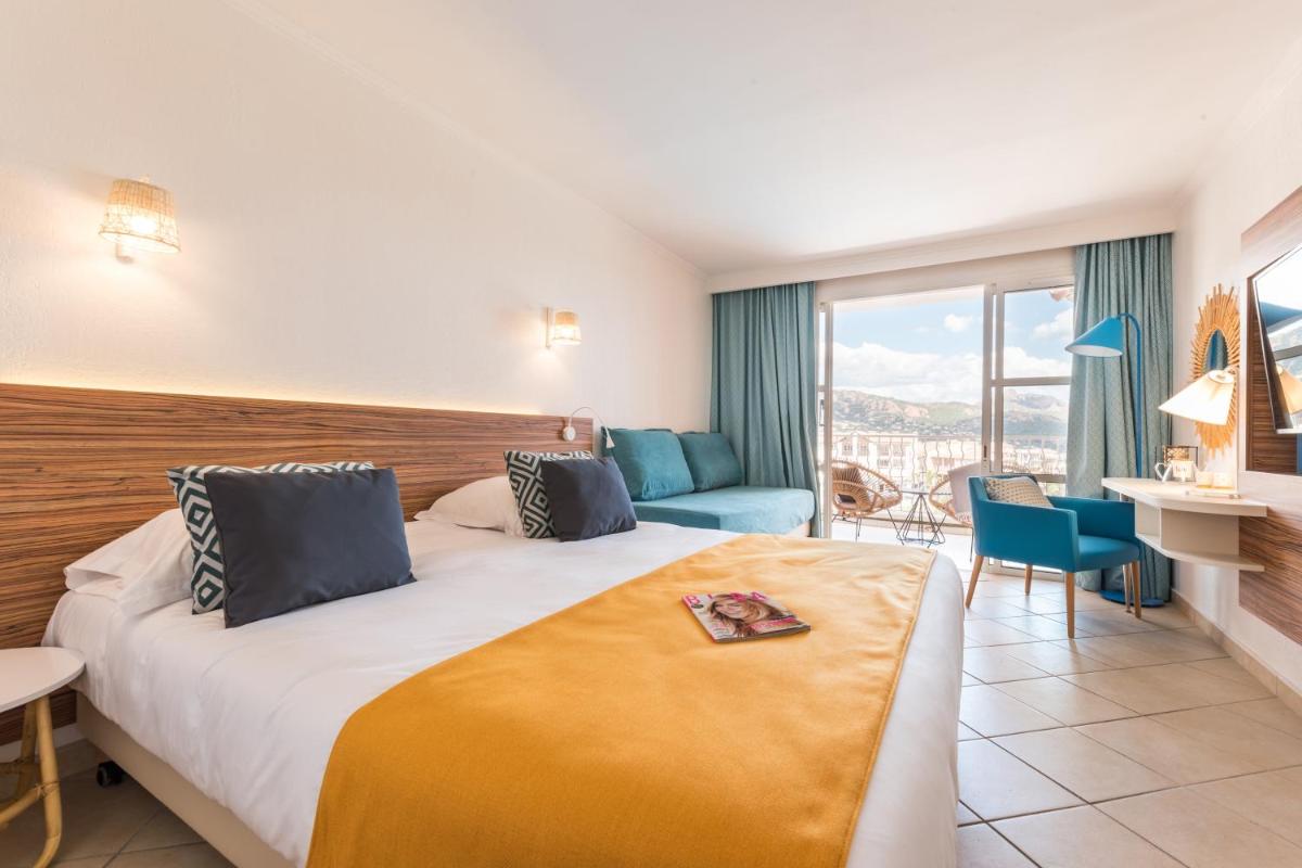 Un ou plusieurs lits dans un hébergement de l'établissement Hôtel de l'Esterel Pierre & Vacances