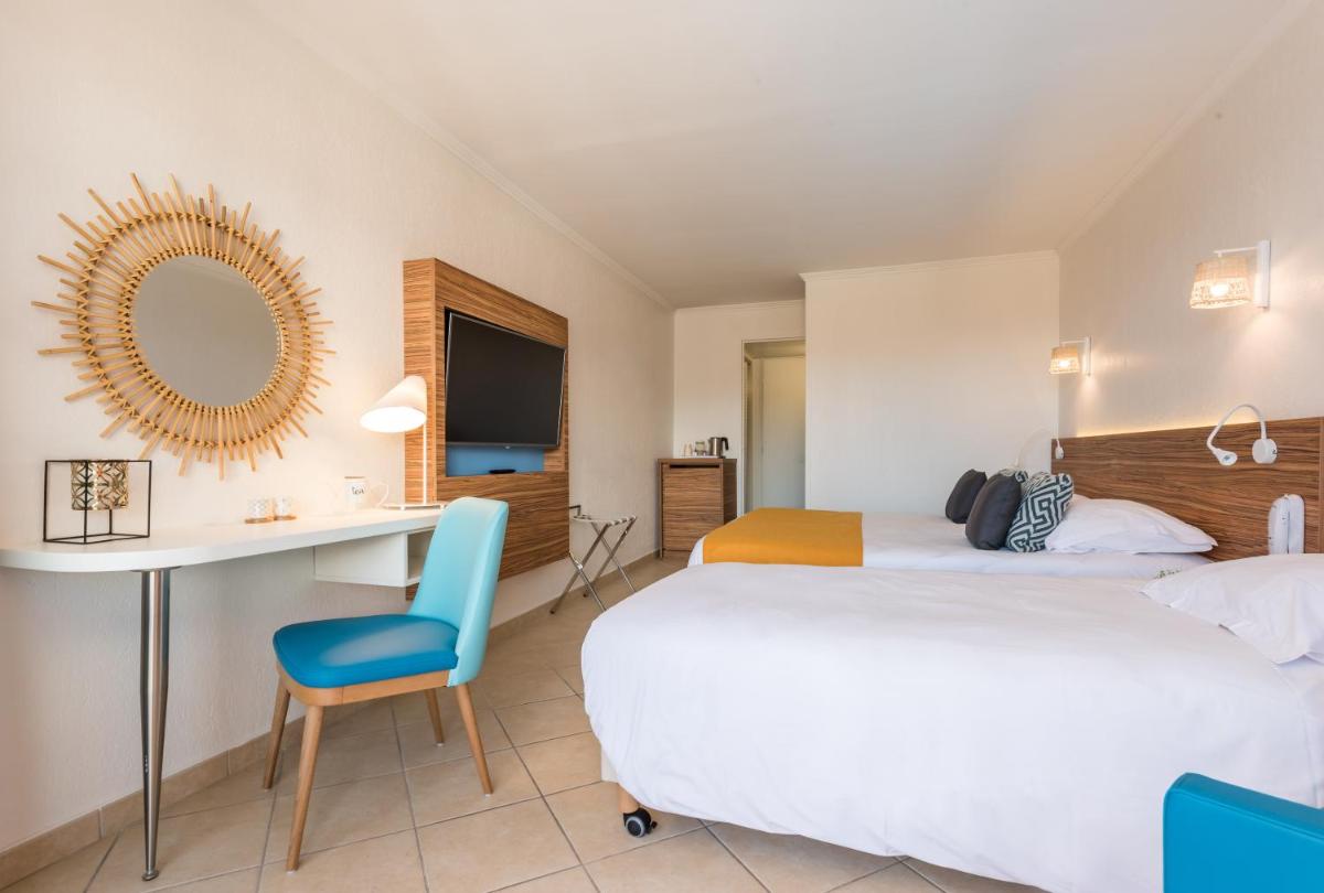 Un ou plusieurs lits dans un hébergement de l'établissement Hôtel de l'Esterel Pierre & Vacances
