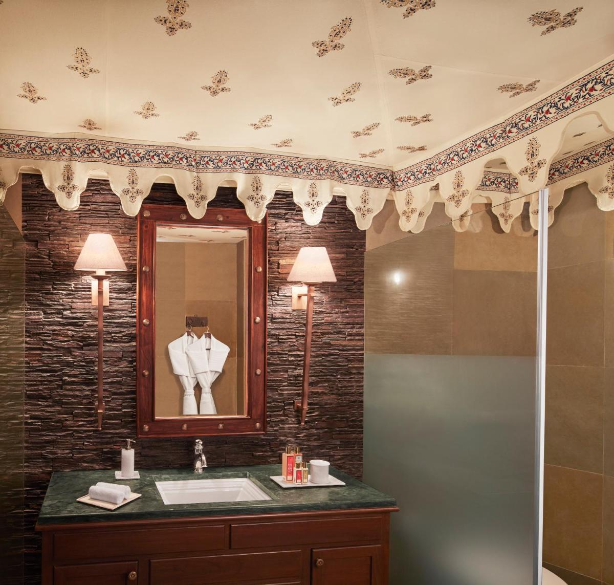 a bathroom with a sink and a mirror at Taj Aravali Resort & Spa Udaipur in Udaipur