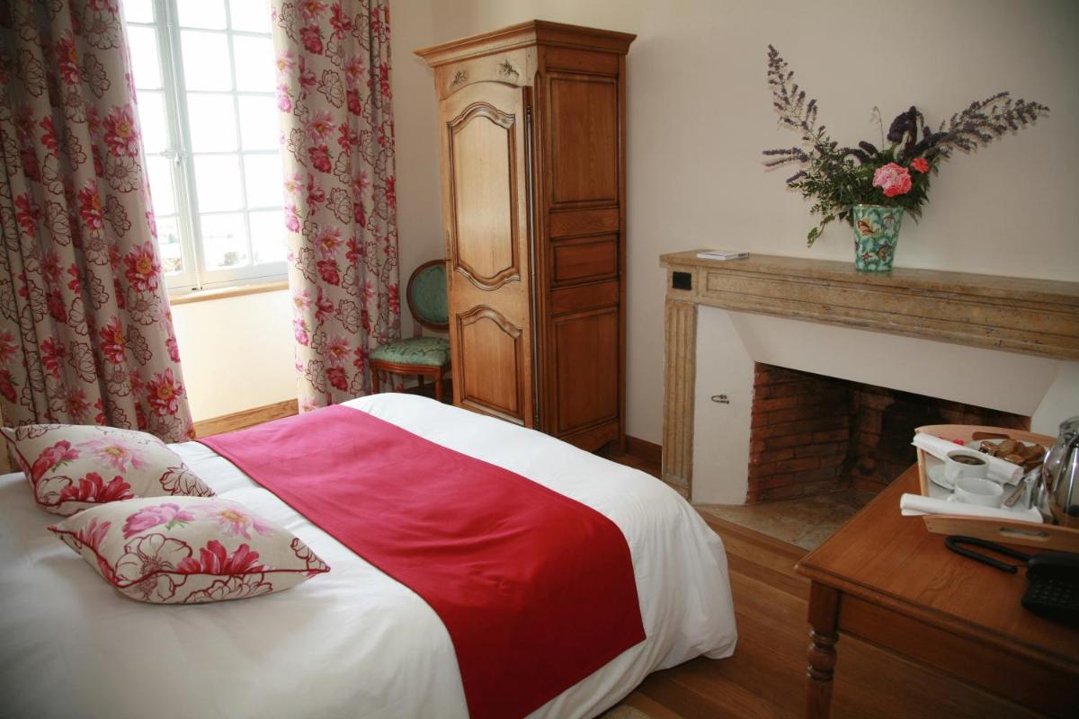 Un ou plusieurs lits dans un hébergement de l'établissement Domaine Saint-Roch Hotel Spa