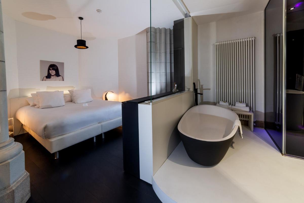 Un ou plusieurs lits dans un hébergement de l'établissement SOZO Hotel