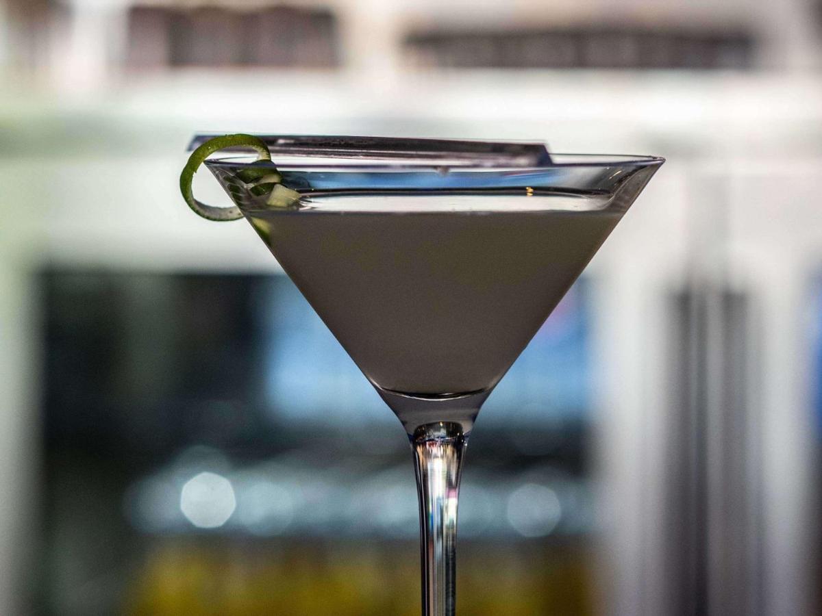 a martini glass with a lime in it at Mercure Hyderabad KCP Banjara Hills, An Accor Hotel in Hyderabad
