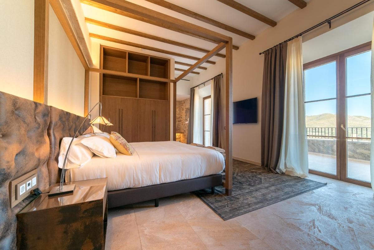 Cama o camas de una habitación en Hotel Creu de Tau Art&Spa-Adults only