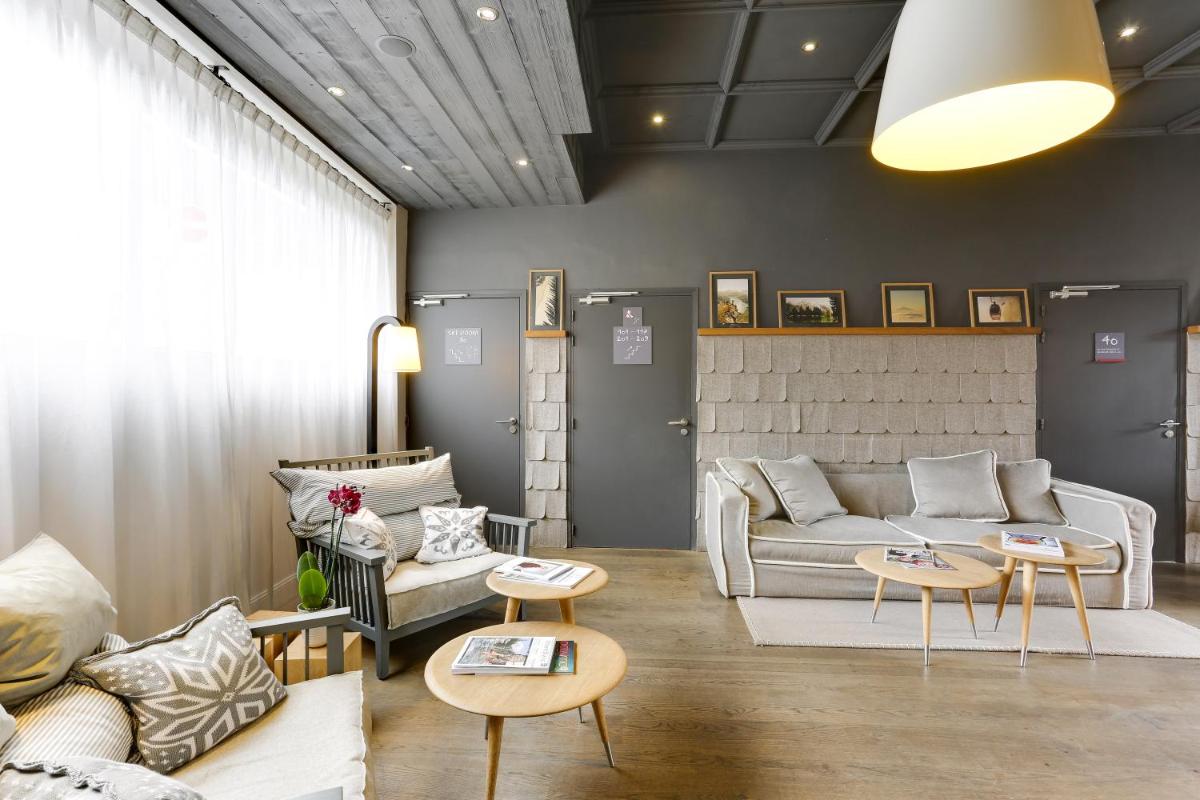 Coin salon dans l'établissement Le Faucigny - Hotel de Charme & SPA