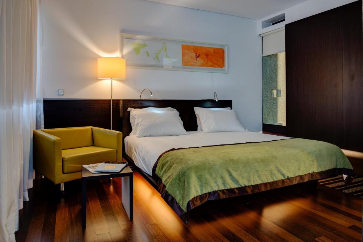 Uma cama ou camas num quarto em VIP Grand Lisboa Hotel & Spa