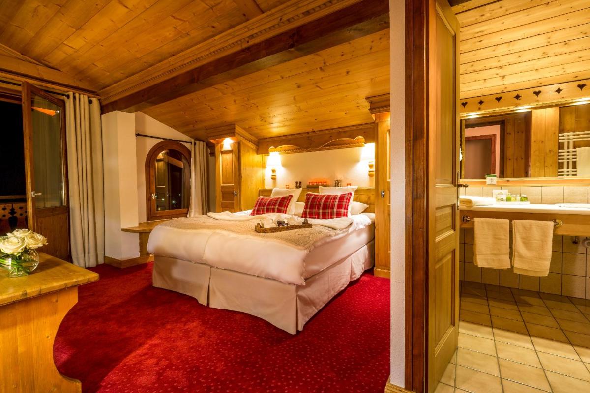 Un ou plusieurs lits dans un hébergement de l'établissement Hotel & Spa Le Dahu