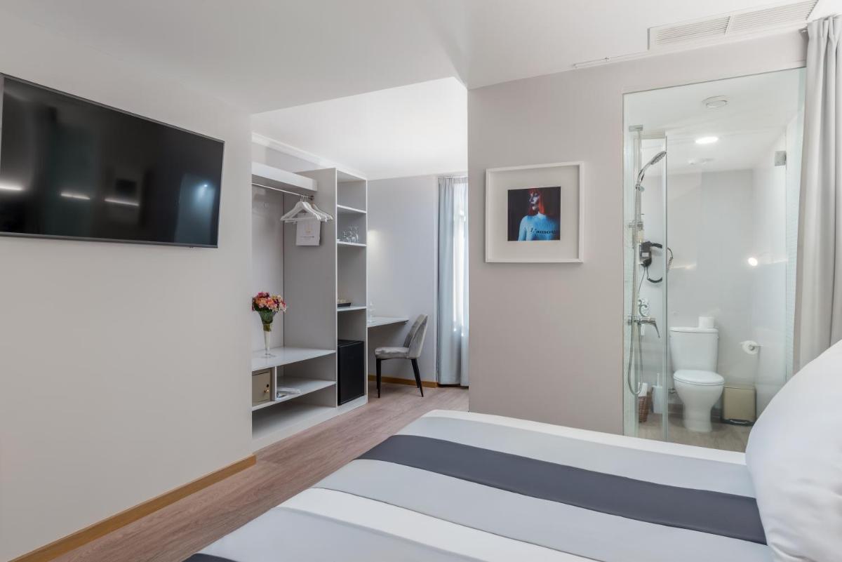 Uma cama ou camas num quarto em Sé Boutique Hotel