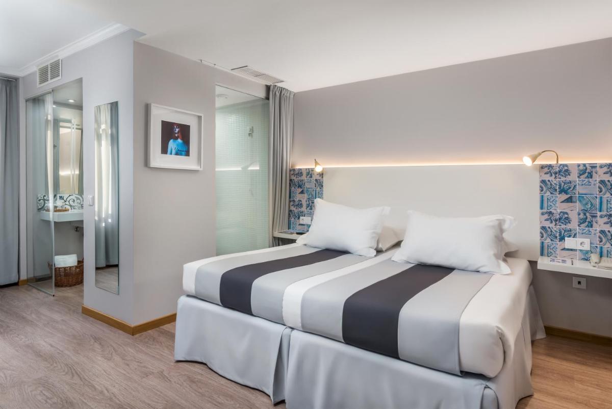Uma cama ou camas num quarto em Sé Boutique Hotel