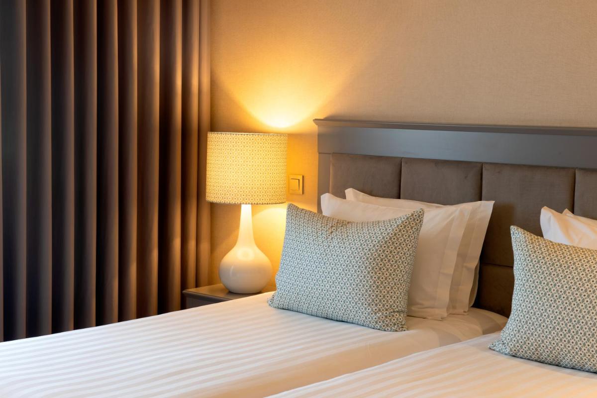 Uma cama ou camas num quarto em Hotel Cristal Vieira Praia & SPA