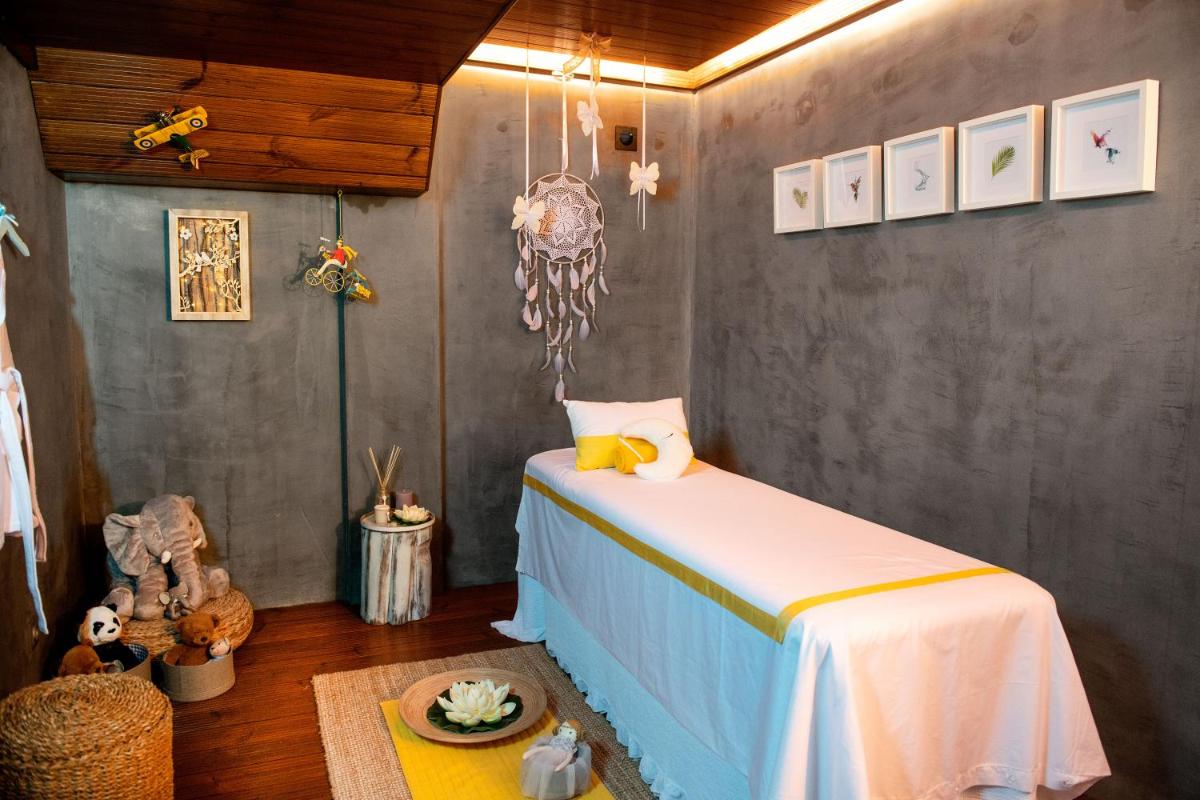 Uma cama ou camas num quarto em Hotel Cristal Vieira Praia & SPA
