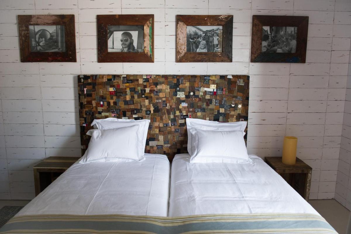 Uma cama ou camas num quarto em Surfers Lodge Peniche