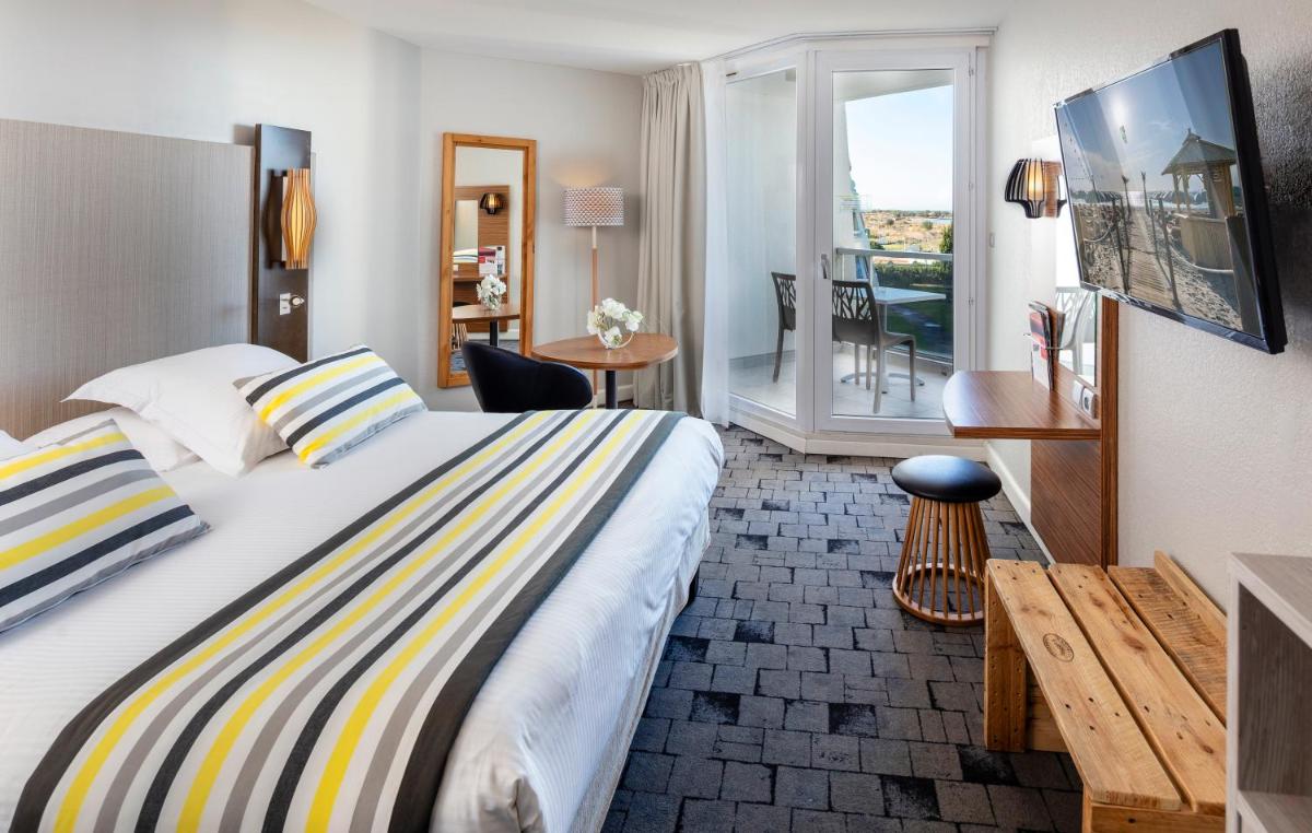 Un ou plusieurs lits dans un hébergement de l'établissement Thalazur Port-Camargue - Hotel & Spa