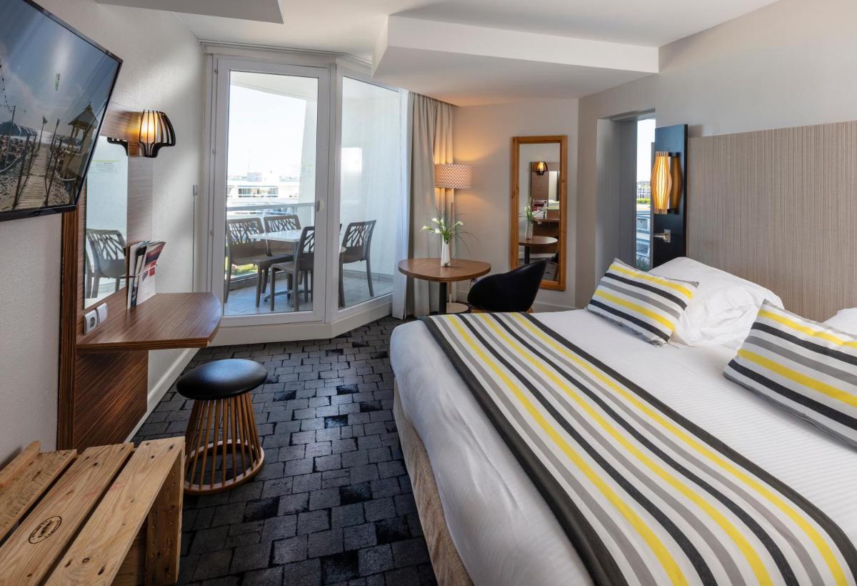 Un ou plusieurs lits dans un hébergement de l'établissement Thalazur Port-Camargue - Hotel & Spa