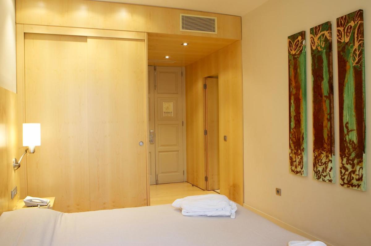 Cama o camas de una habitación en Hotel Sant Roc