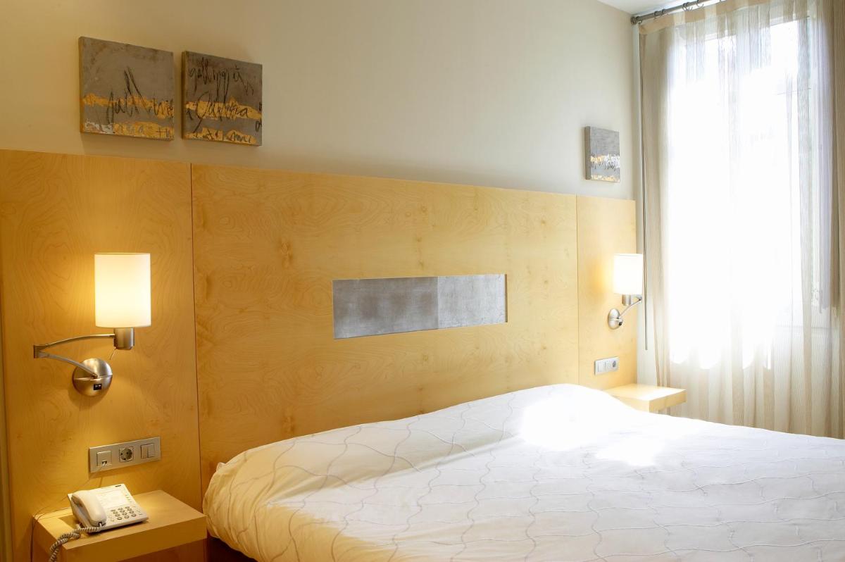 Cama o camas de una habitación en Hotel Sant Roc