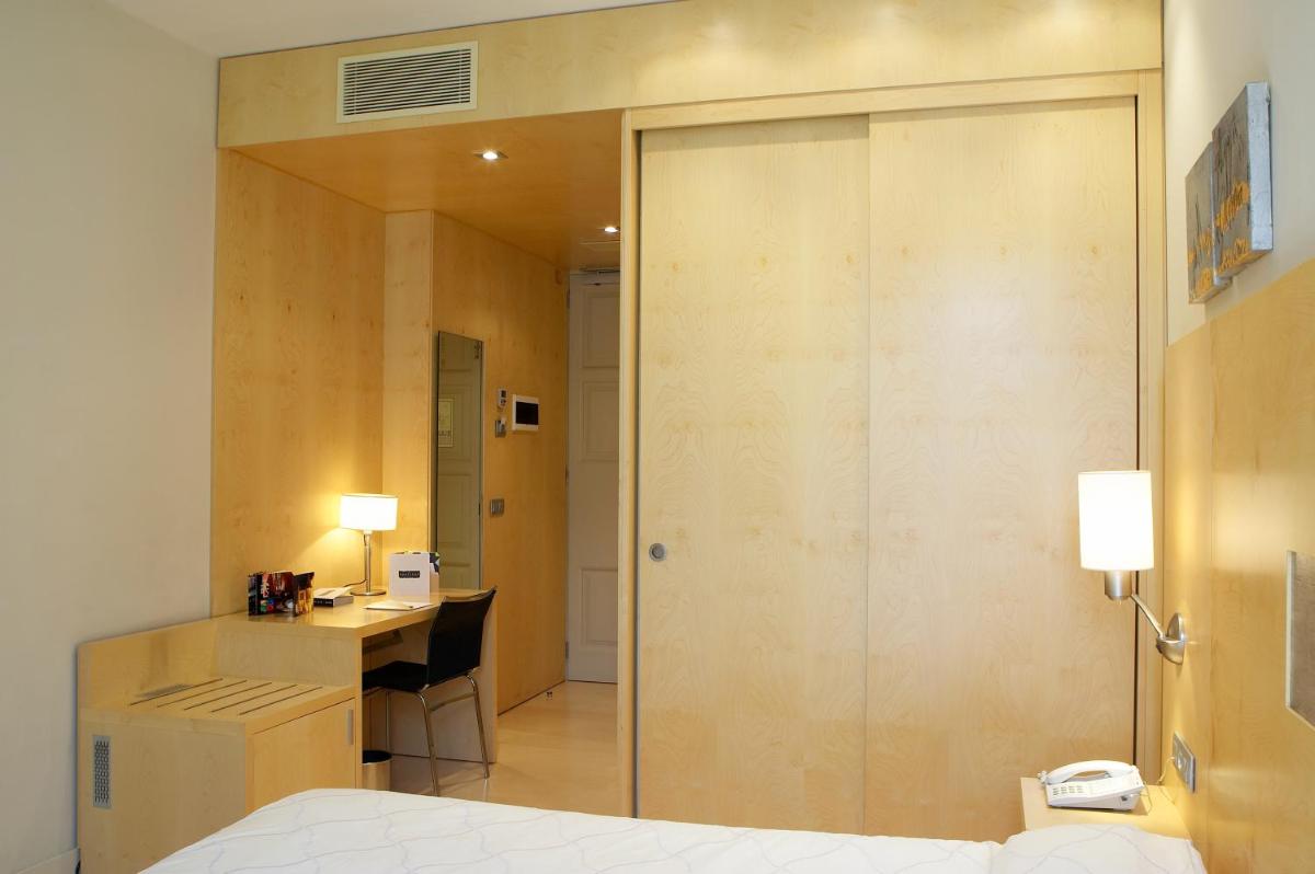 Cama o camas de una habitación en Hotel Sant Roc