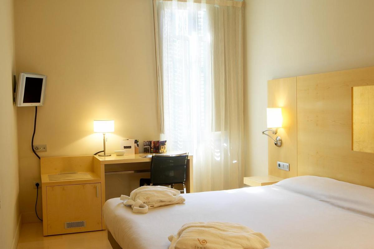 Cama o camas de una habitación en Hotel Sant Roc