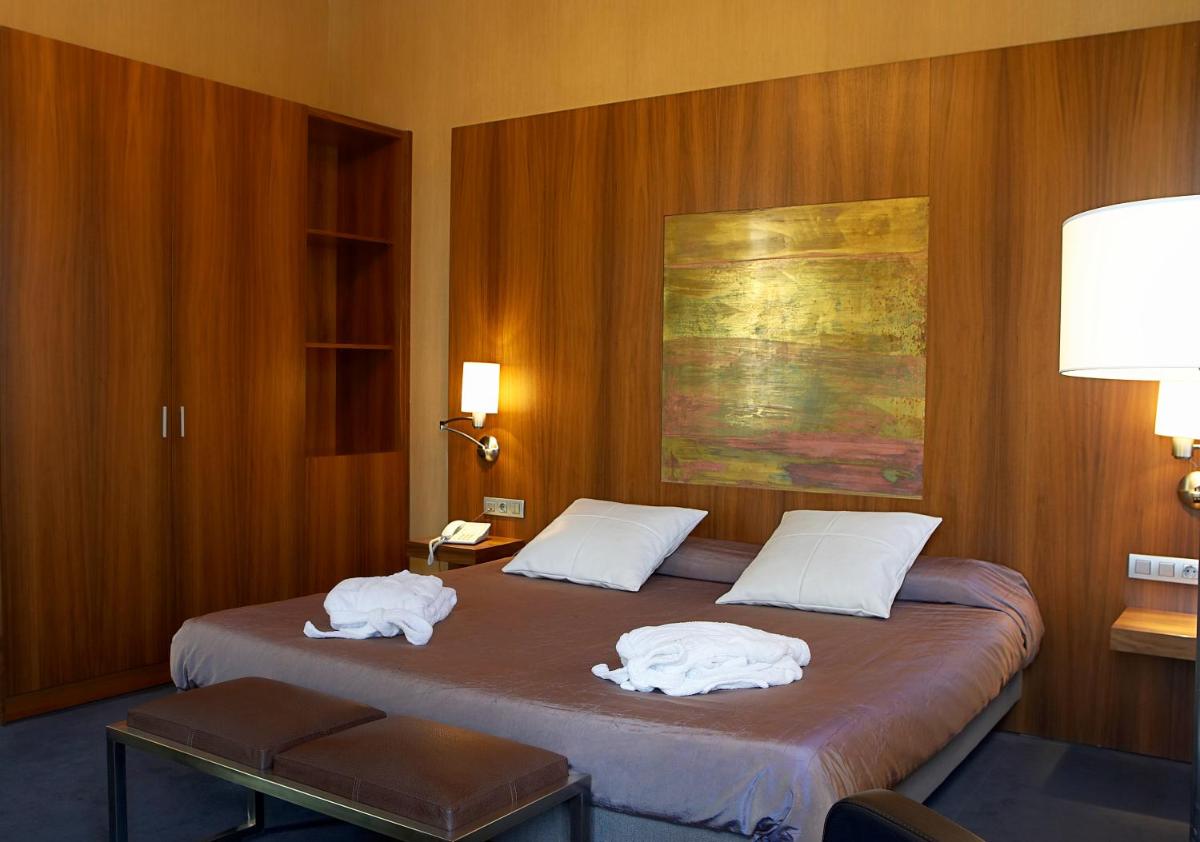 Cama o camas de una habitación en Hotel Sant Roc