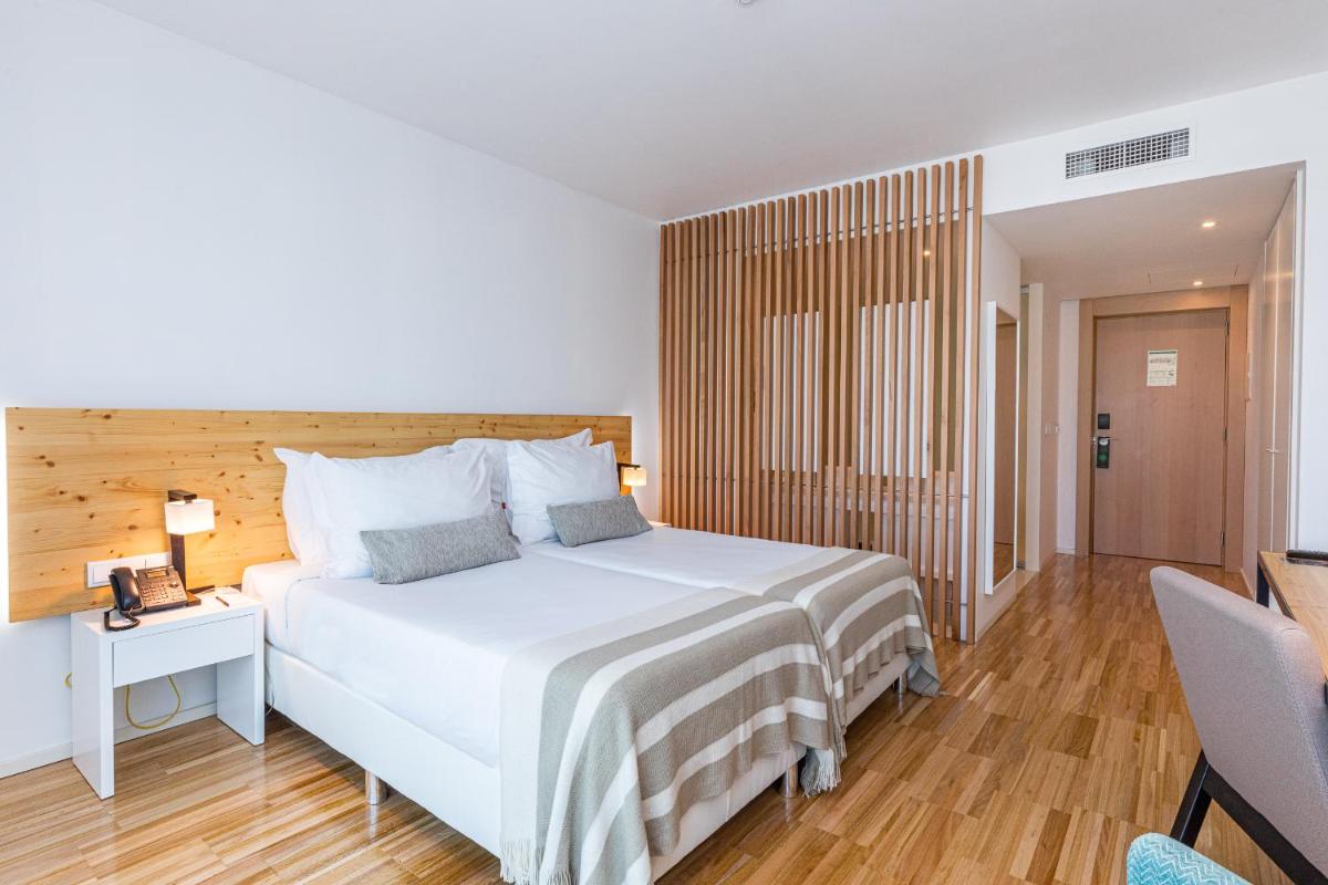 Uma cama ou camas num quarto em Algarve Race Resort - Hotel