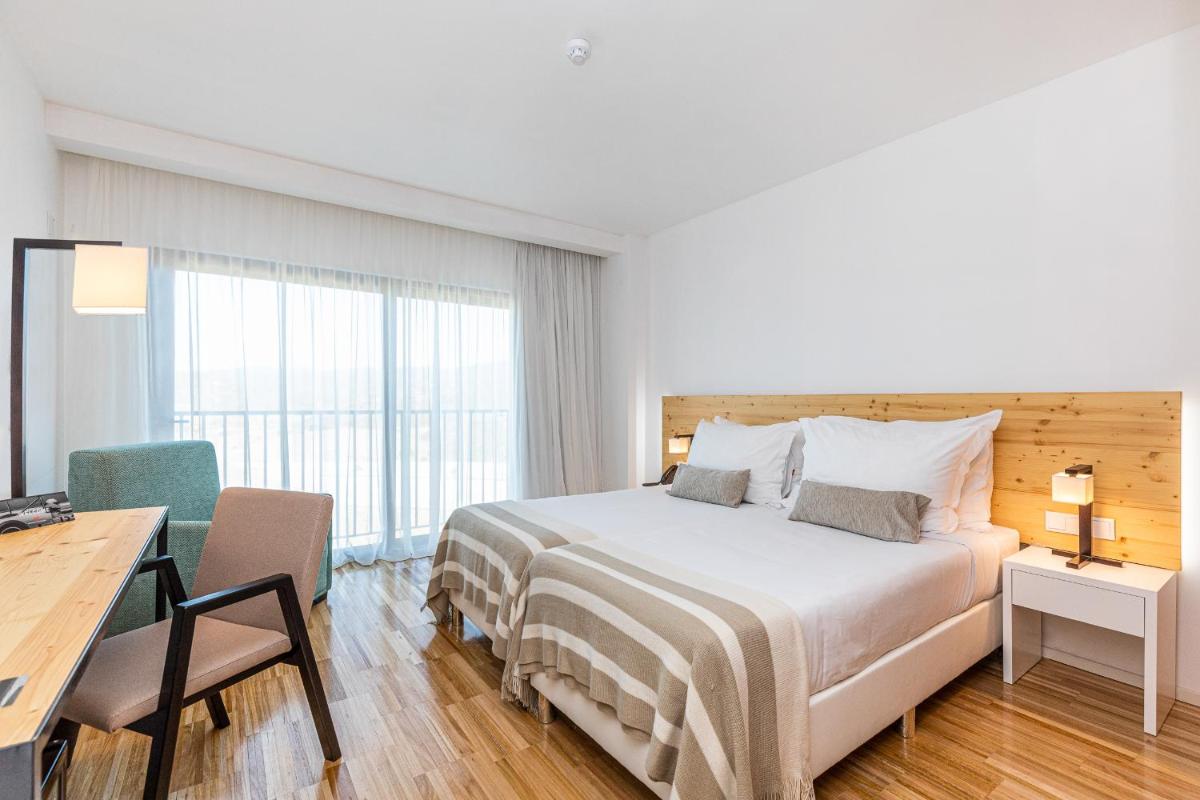 Uma cama ou camas num quarto em Algarve Race Resort - Hotel