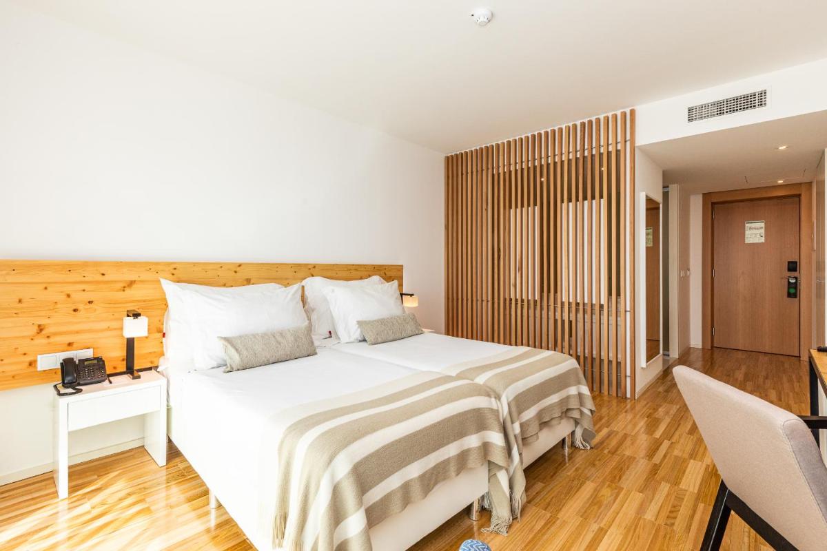 Uma cama ou camas num quarto em Algarve Race Resort - Hotel