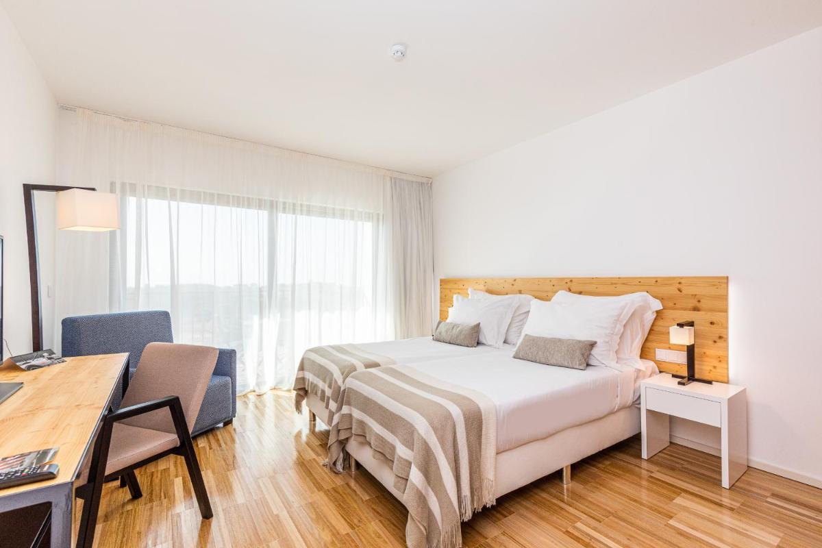 Uma cama ou camas num quarto em Algarve Race Resort - Hotel