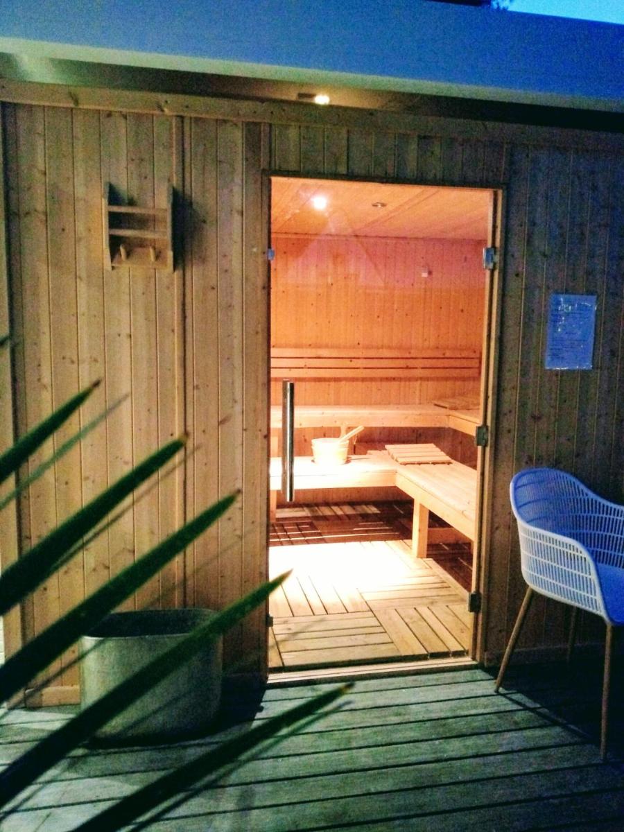 Coin salon dans l'établissement Le Diana Hôtel & Spa