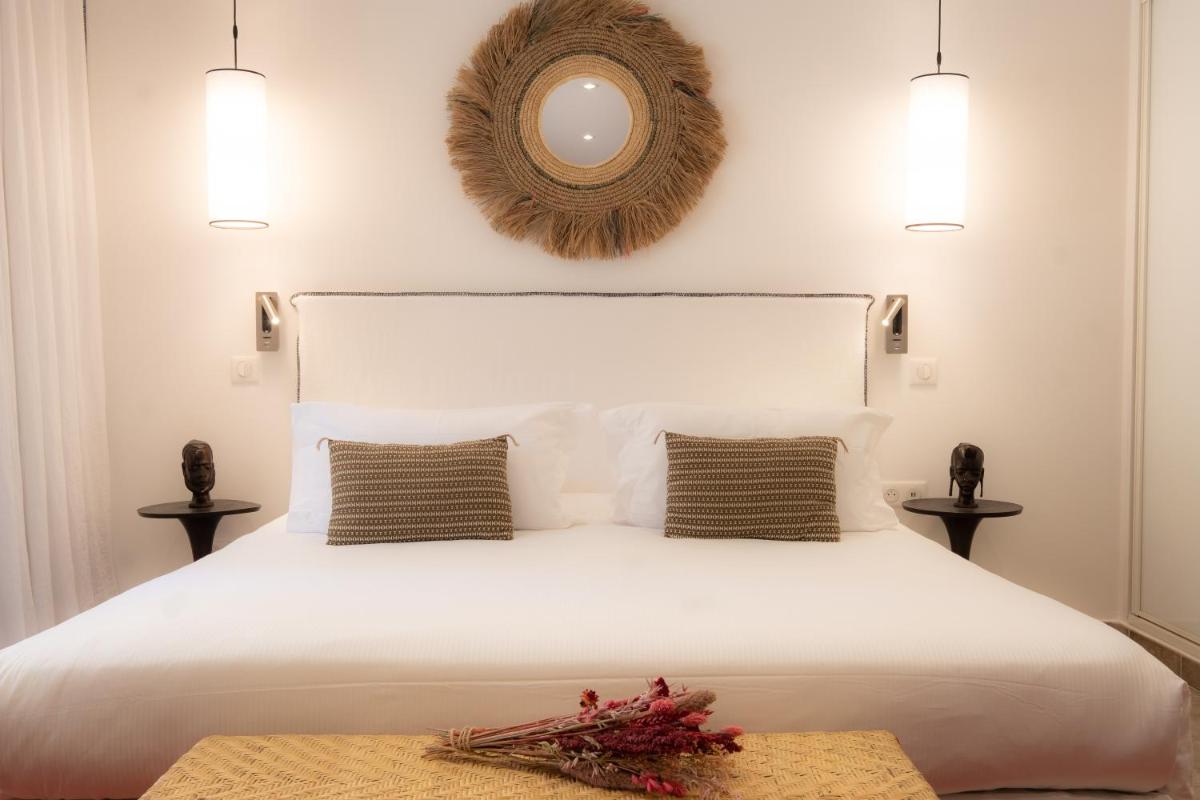 Un ou plusieurs lits dans un hébergement de l'établissement Hôtel La Dimora & Spa