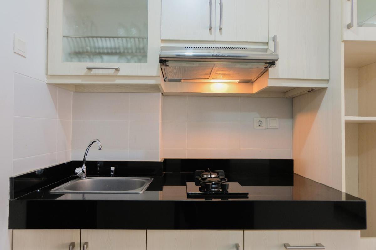 Simply Furnished Studio Apartment at Scientia Residence By Travelio - Housity