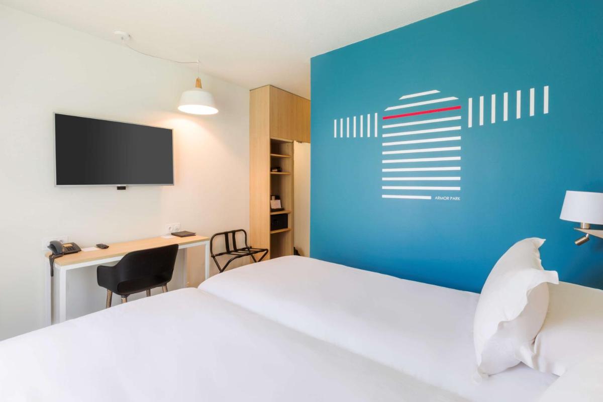 Un ou plusieurs lits dans un hébergement de l'établissement Best Western Armor Park Dinan et Spa