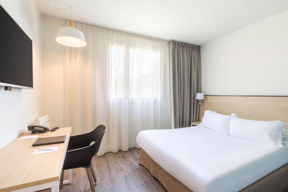 Un ou plusieurs lits dans un hébergement de l'établissement Best Western Armor Park Dinan et Spa