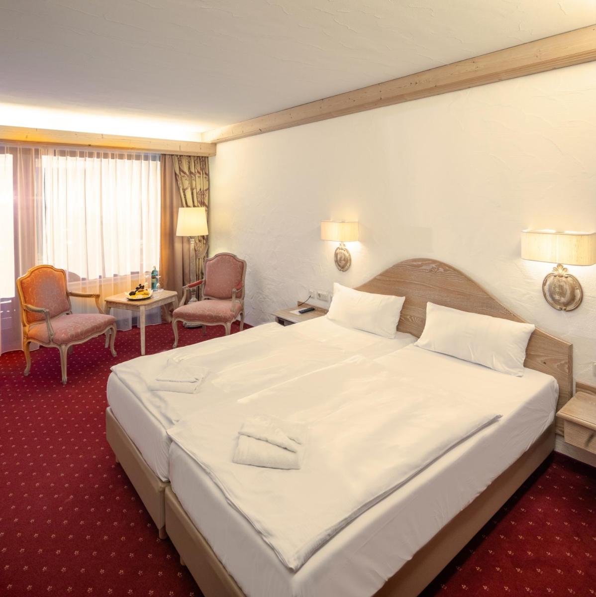 Ein Bett oder Betten in einem Zimmer der Unterkunft Mühl Vital Resort