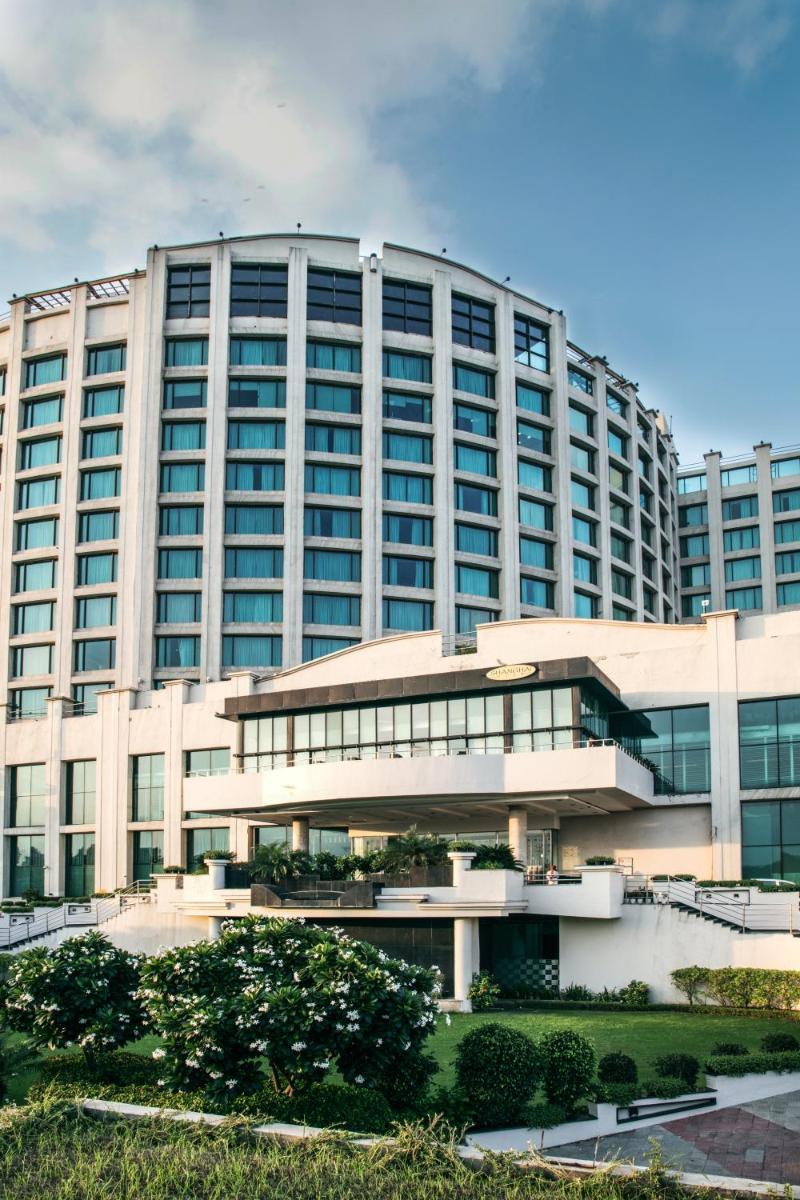 a large white building with a lot of windows at Welcomhotel by ITC Hotels, Dwarka, New Delhi in New Delhi a large white building with a lot of windows at Welcomhotel by ITC Hotels, Dwarka, New Delhi in New Delhi