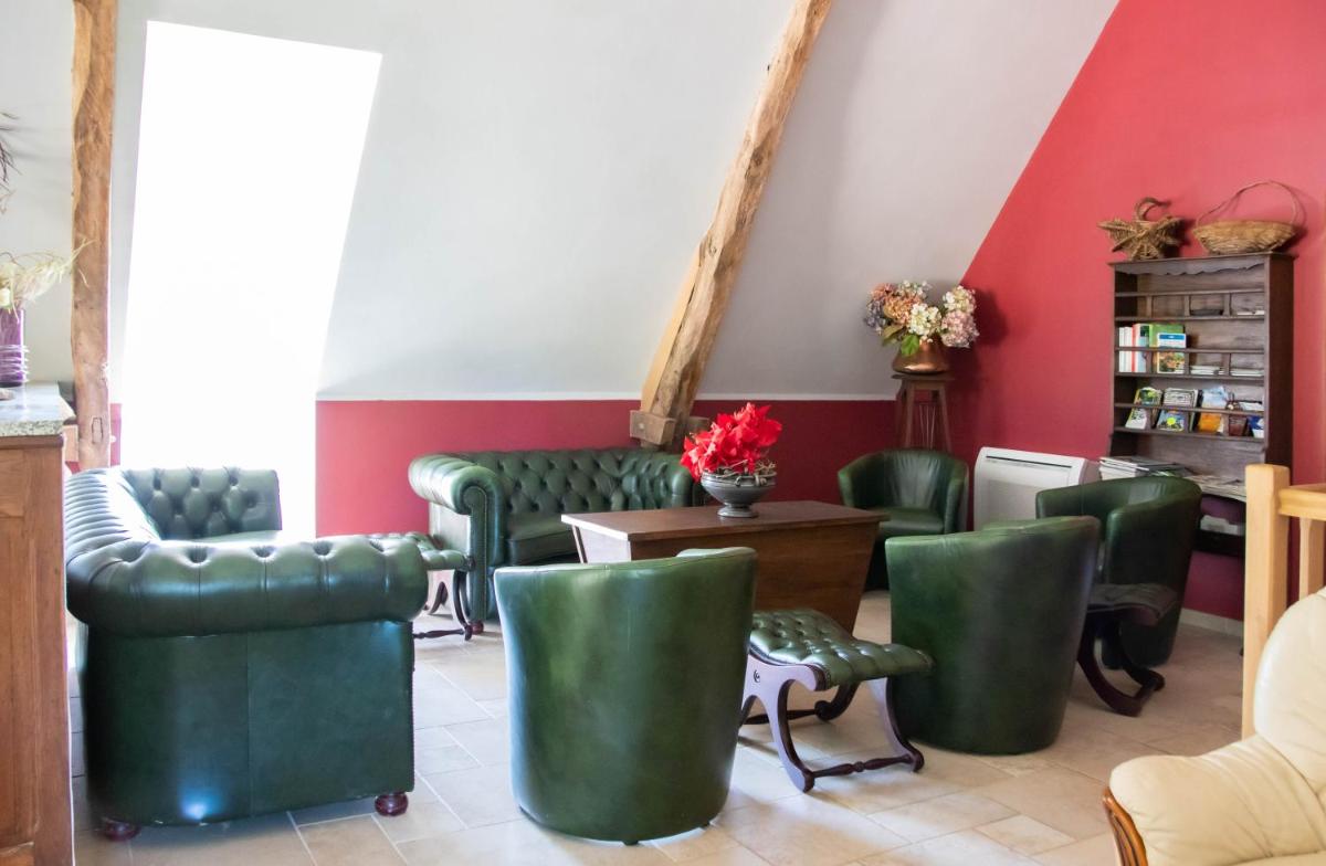 Coin salon dans l'établissement Domaine de Janis & Spa