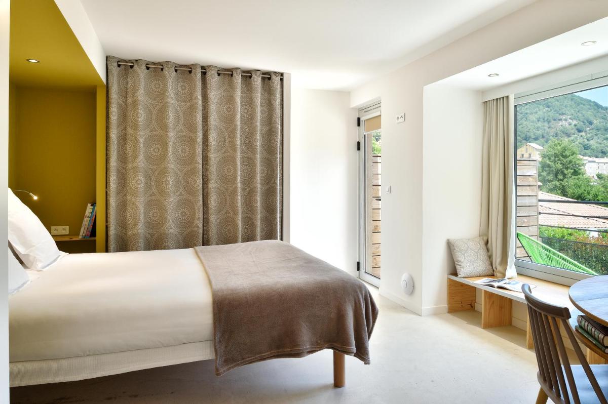 Un ou plusieurs lits dans un hébergement de l'établissement Artemisia Boutique Hotel