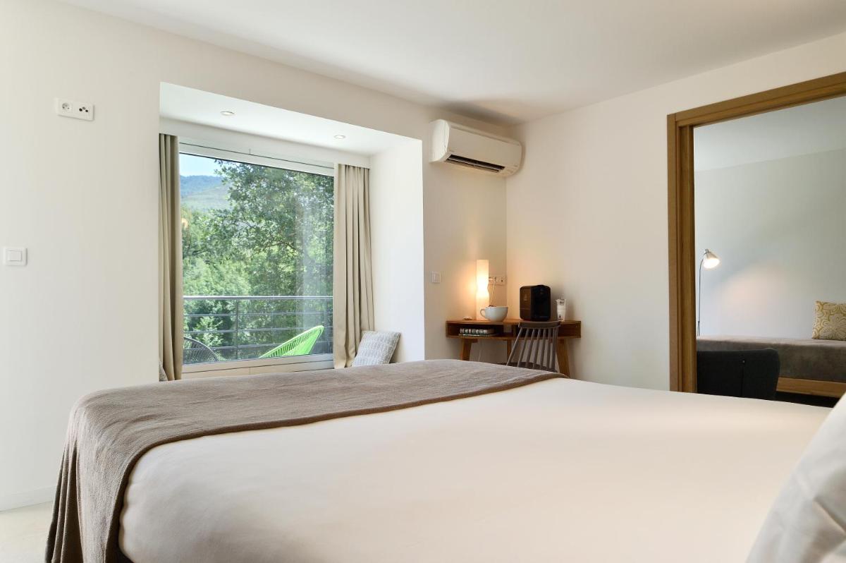 Un ou plusieurs lits dans un hébergement de l'établissement Artemisia Boutique Hotel