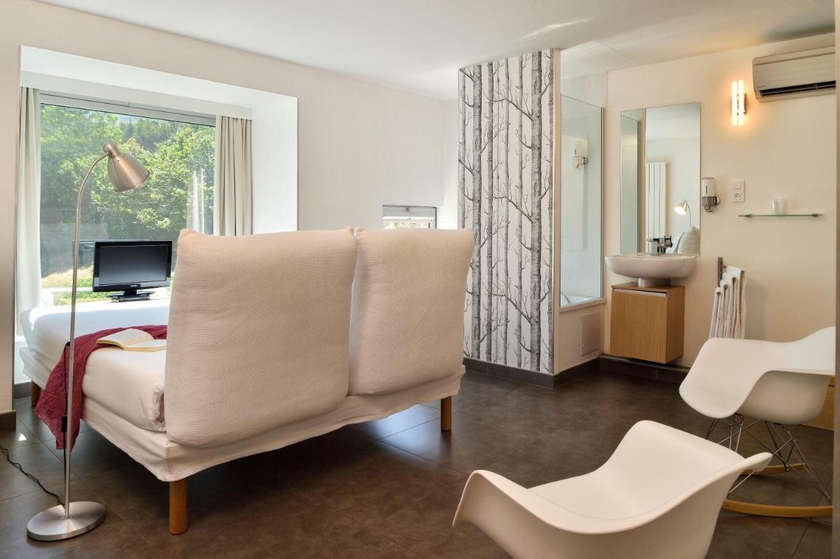 Télévision ou salle de divertissement dans l'établissement Artemisia Boutique Hotel