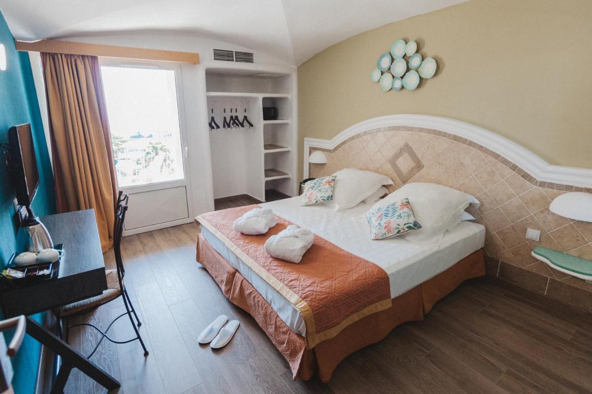 Un ou plusieurs lits dans un hébergement de l'établissement Ostella Spa & Resort