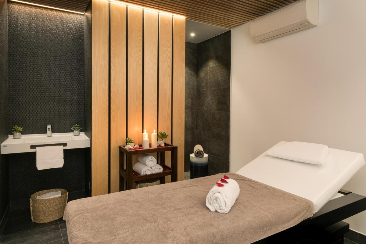 Un ou plusieurs lits dans un hébergement de l'établissement 7Hotel&Spa