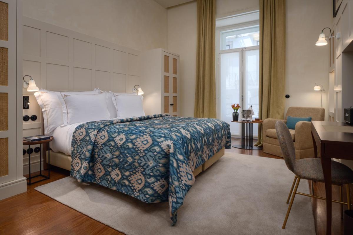 Uma cama ou camas num quarto em Bairro Alto Hotel