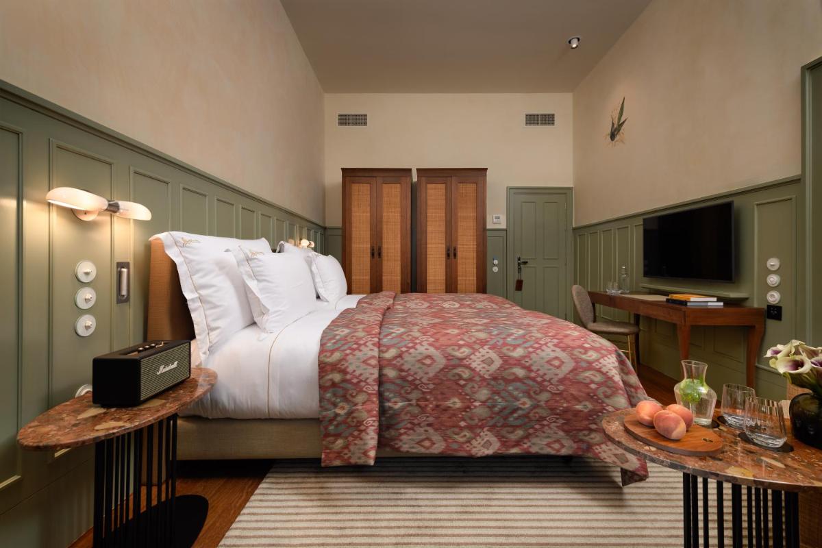 Uma cama ou camas num quarto em Bairro Alto Hotel