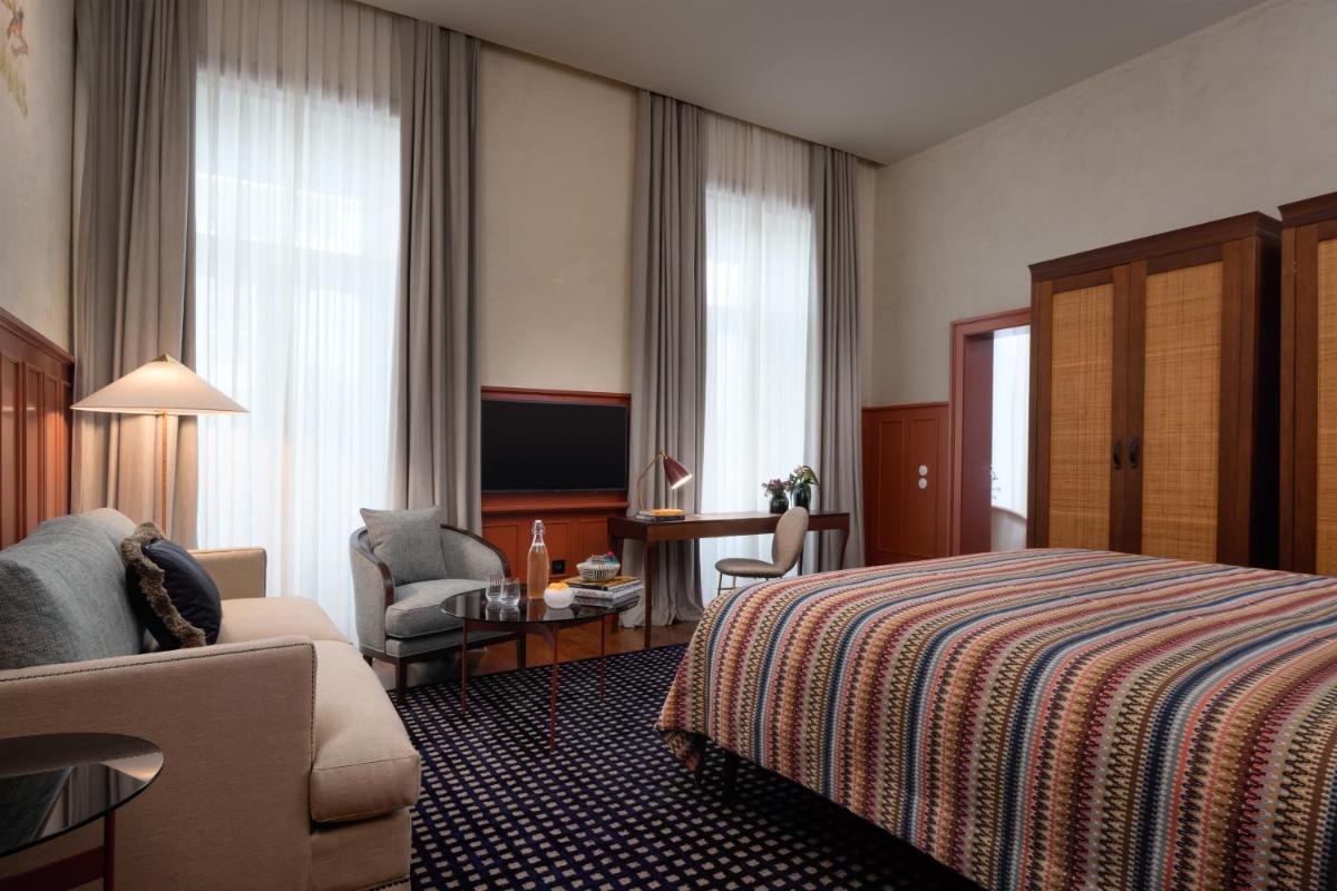 Uma cama ou camas num quarto em Bairro Alto Hotel