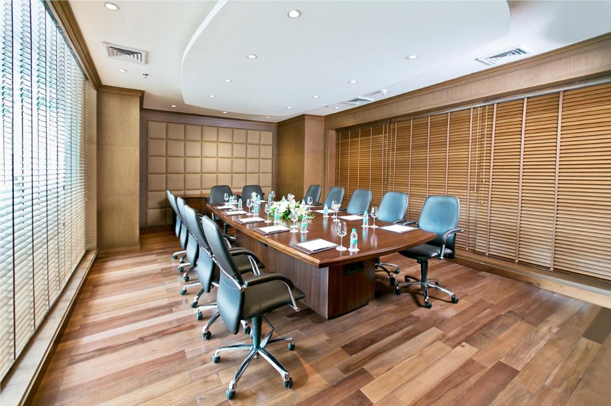 a large conference room with a long table and chairs at The Lalit Jaipur in Jaipur