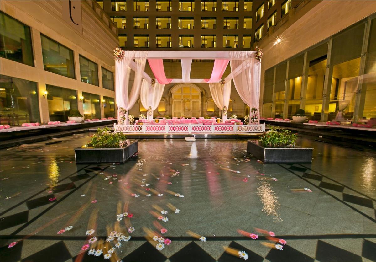 a room with a altar in the middle of a building at The Lalit Jaipur in Jaipur